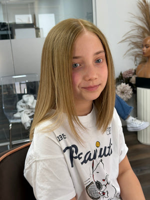 Side view of Daisychildren’s human hair wig
