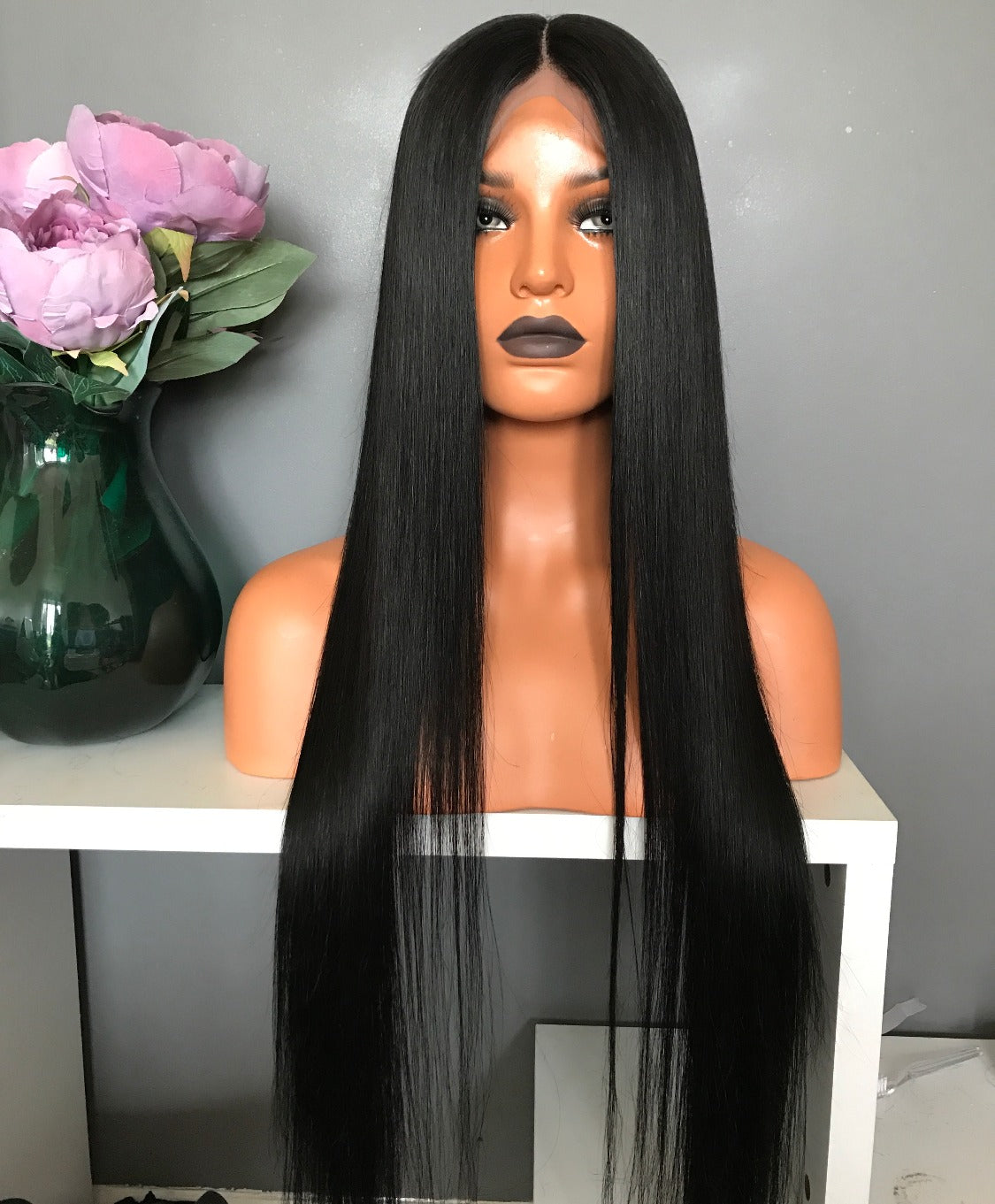 Model wearing black 28-inch HD lace human hair wig in body wave texture – Nuola Wigs.