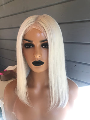 Model wearing blonde balayage 14-inch HD lace human hair wig in body wave texture – Nuola Wigs.