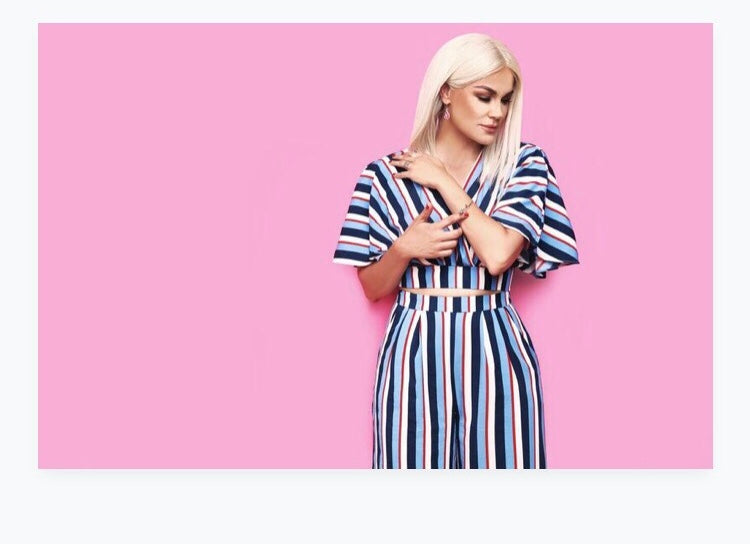 Model wearing blonde balayage 14-inch HD lace human hair wig in body wave texture – Nuola Wigs.