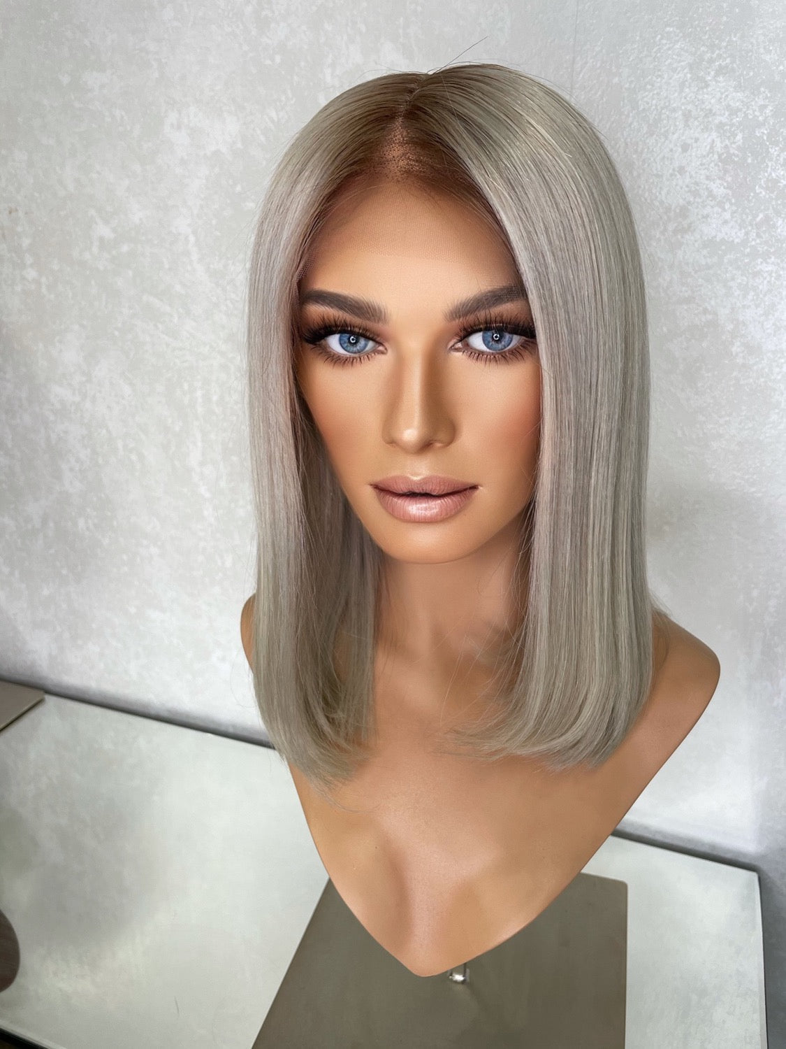Model wearing blonde balayage 14-inch HD lace human hair wig in body wave texture – Nuola Wigs.
