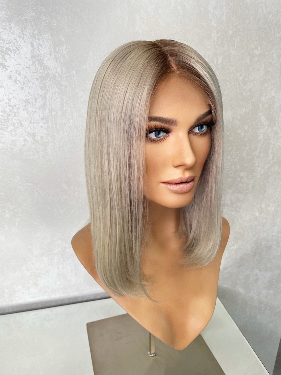 Model wearing blonde balayage 14-inch HD lace human hair wig in body wave texture – Nuola Wigs.