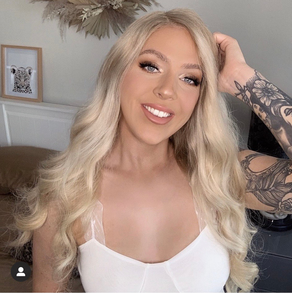 Model wearing blonde balayage 22-inch HD lace human hair wig in body wave texture – Nuola Wigs.