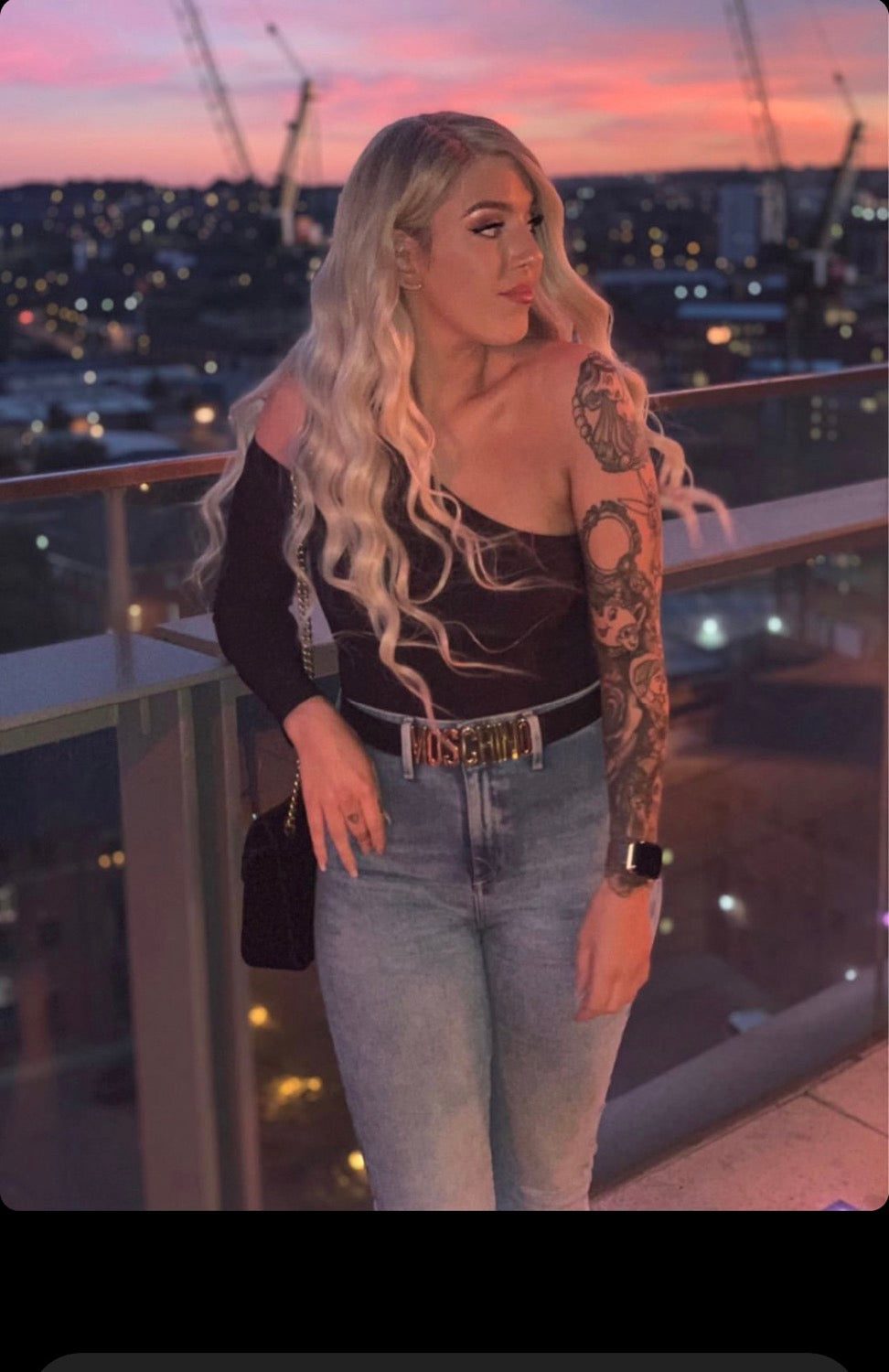 Model wearing blonde balayage 22-inch HD lace human hair wig in body wave texture – Nuola Wigs.