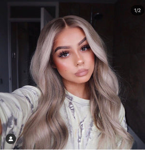 Model wearing blonde balayage 22-inch HD lace human hair wig in body wave texture – Nuola Wigs.