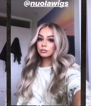 Model wearing blonde balayage 22-inch HD lace human hair wig in body wave texture – Nuola Wigs.