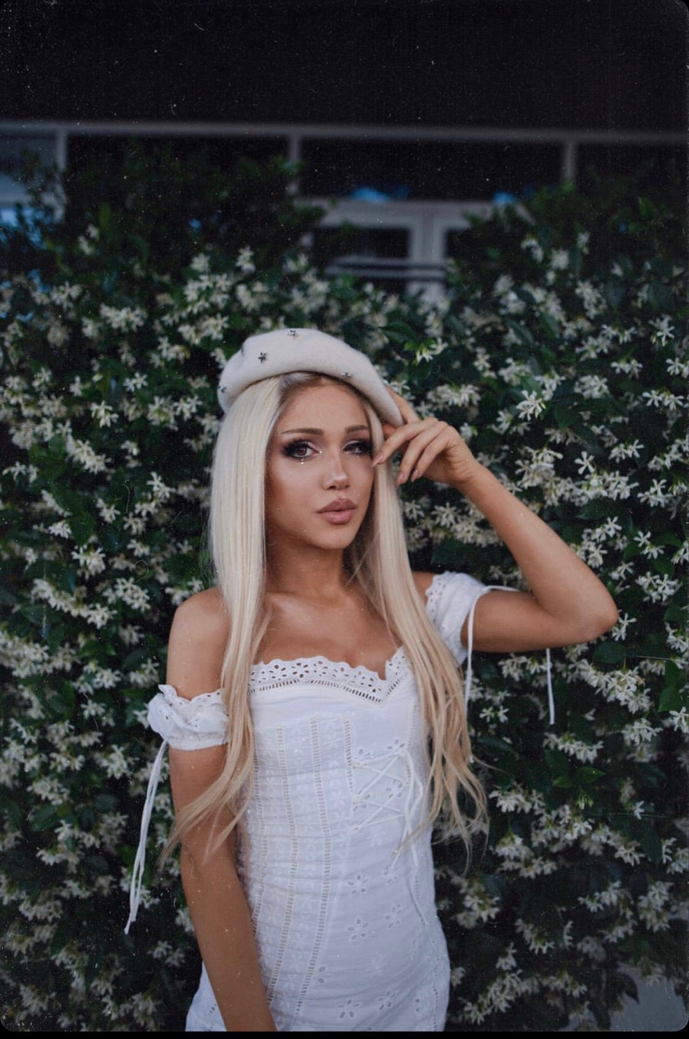 Model wearing blonde balayage 22-inch HD lace human hair wig in body wave texture – Nuola Wigs.