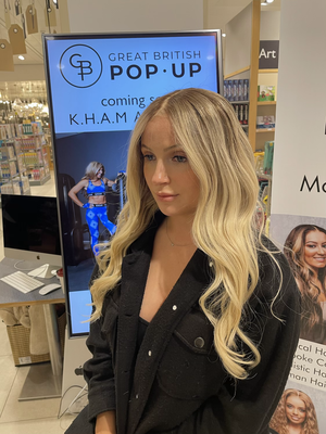 Model wearing blonde balayage 22-inch HD lace human hair wig in body wave texture – Nuola Wigs.