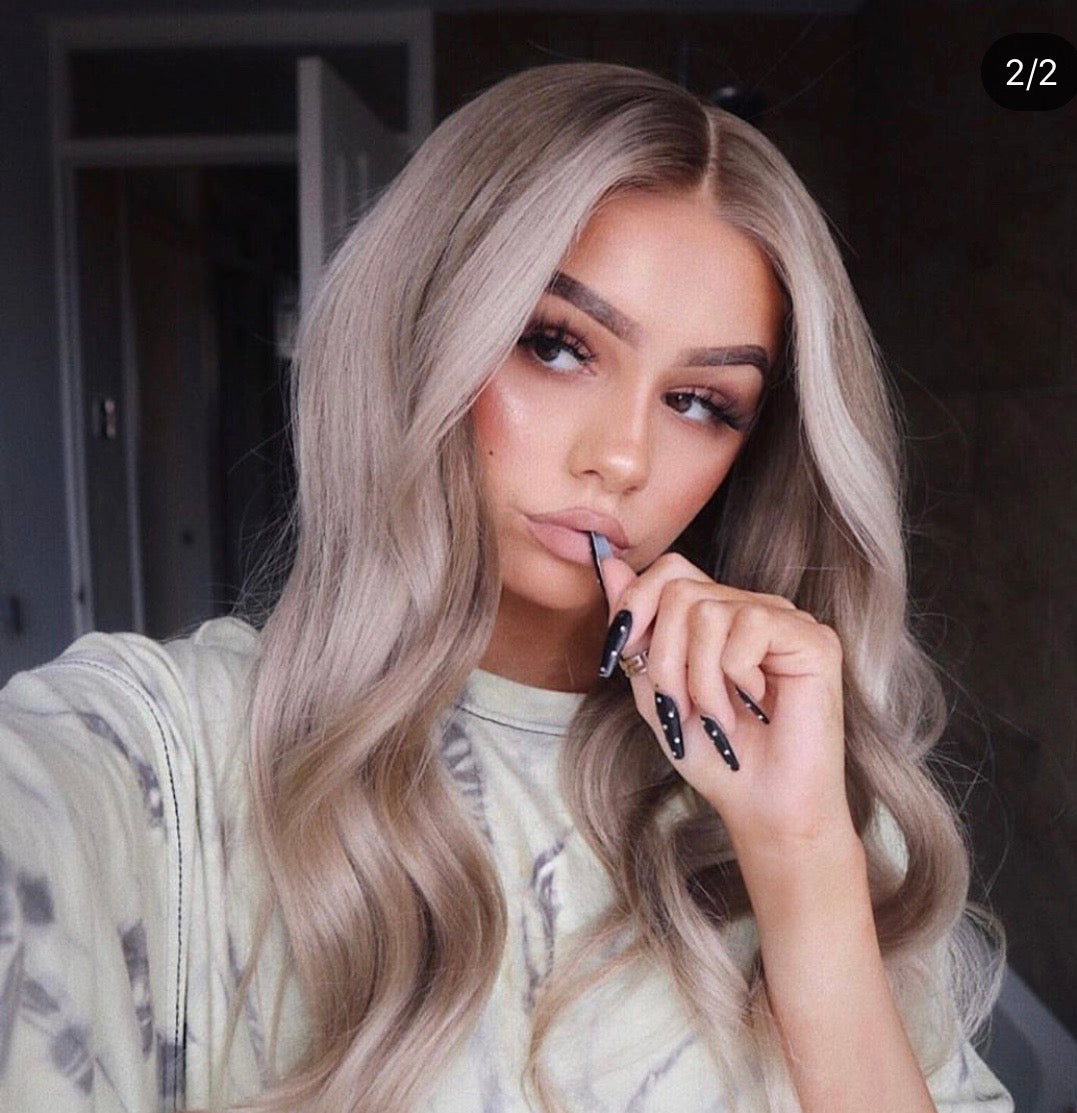 Model wearing blonde balayage 22-inch HD lace human hair wig in body wave texture – Nuola Wigs.