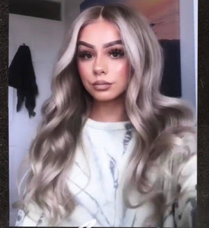 Model wearing blonde balayage 22-inch HD lace human hair wig in body wave texture – Nuola Wigs.