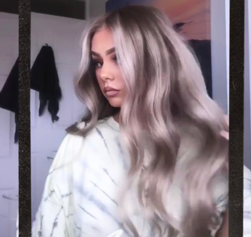 Model wearing blonde balayage 22-inch HD lace human hair wig in body wave texture – Nuola Wigs.