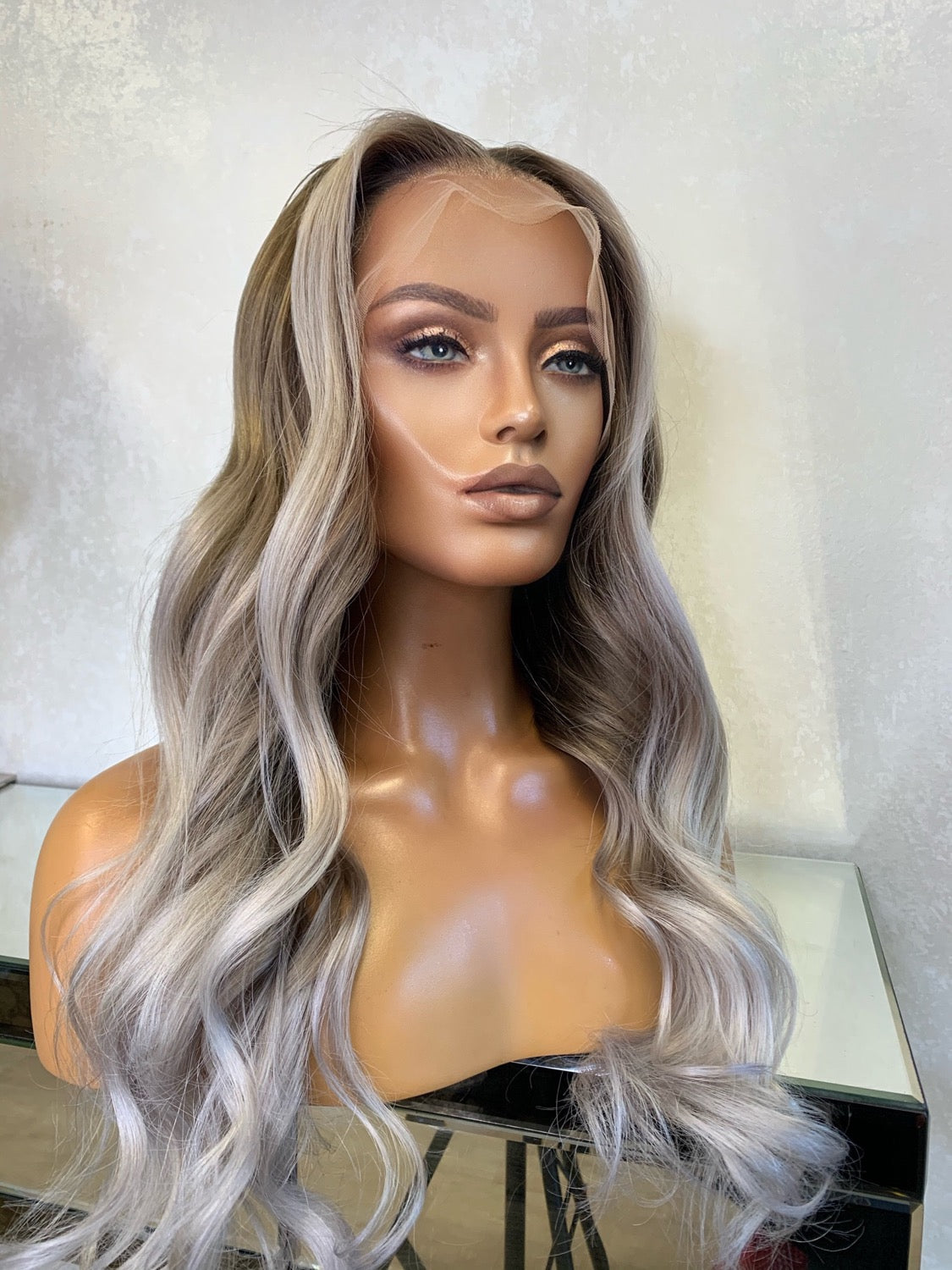 Model wearing blonde balayage 22-inch HD lace human hair wig in body wave texture – Nuola Wigs.