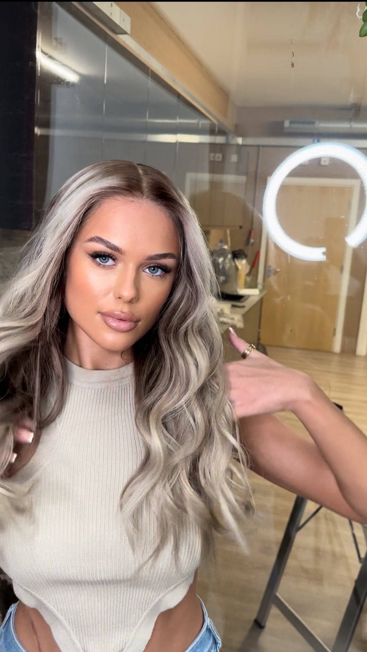 Model wearing blonde balayage 24-inch HD lace human hair wig in body wave texture – Nuola Wigs.