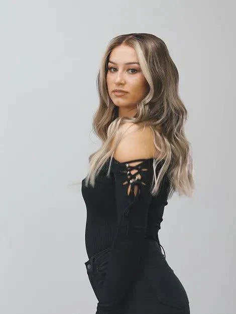 Model wearing blonde balayage 24-inch HD lace human hair wig in body wave texture – Nuola Wigs.