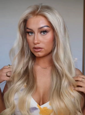 Model wearing blonde balayage 24-inch HD lace human hair wig in body wave texture – Nuola Wigs.
