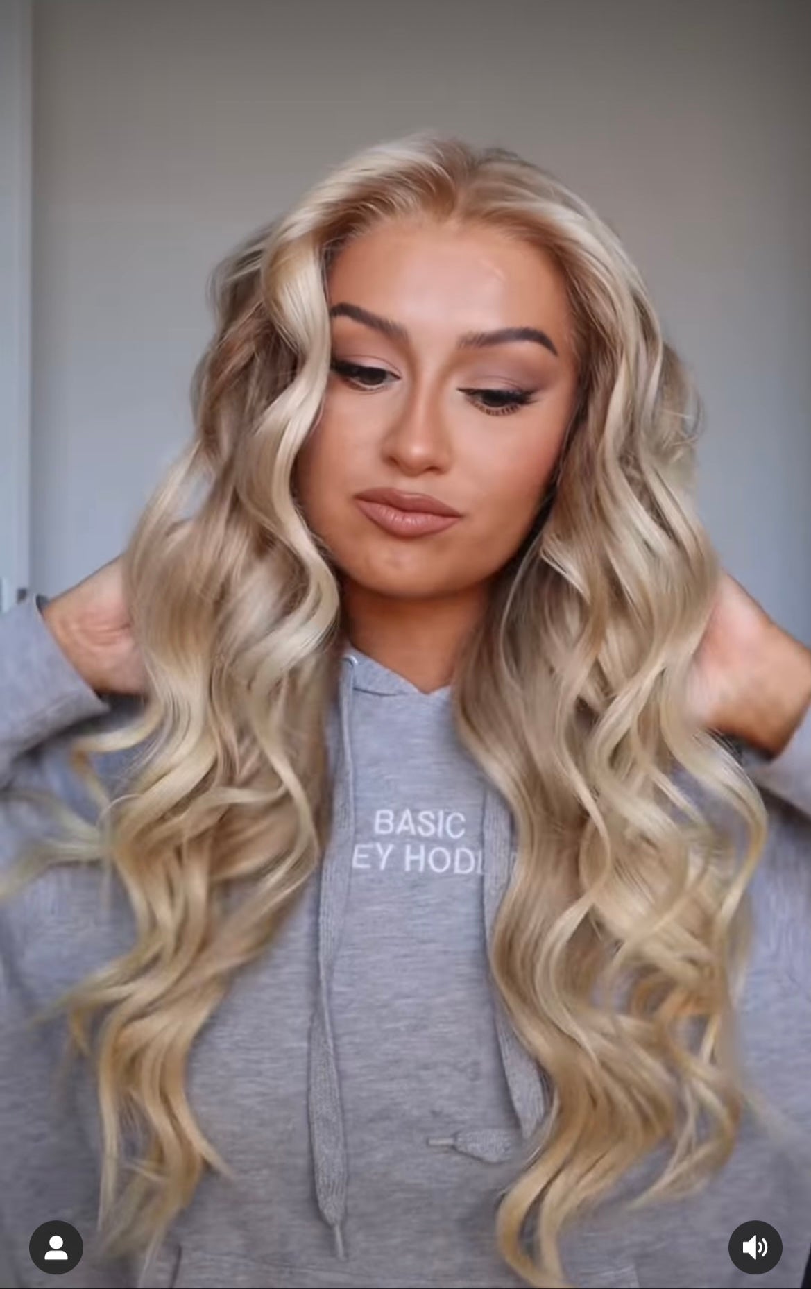 Model wearing blonde balayage 24-inch HD lace human hair wig in body wave texture – Nuola Wigs.