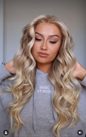 Model wearing blonde balayage 24-inch HD lace human hair wig in body wave texture – Nuola Wigs.