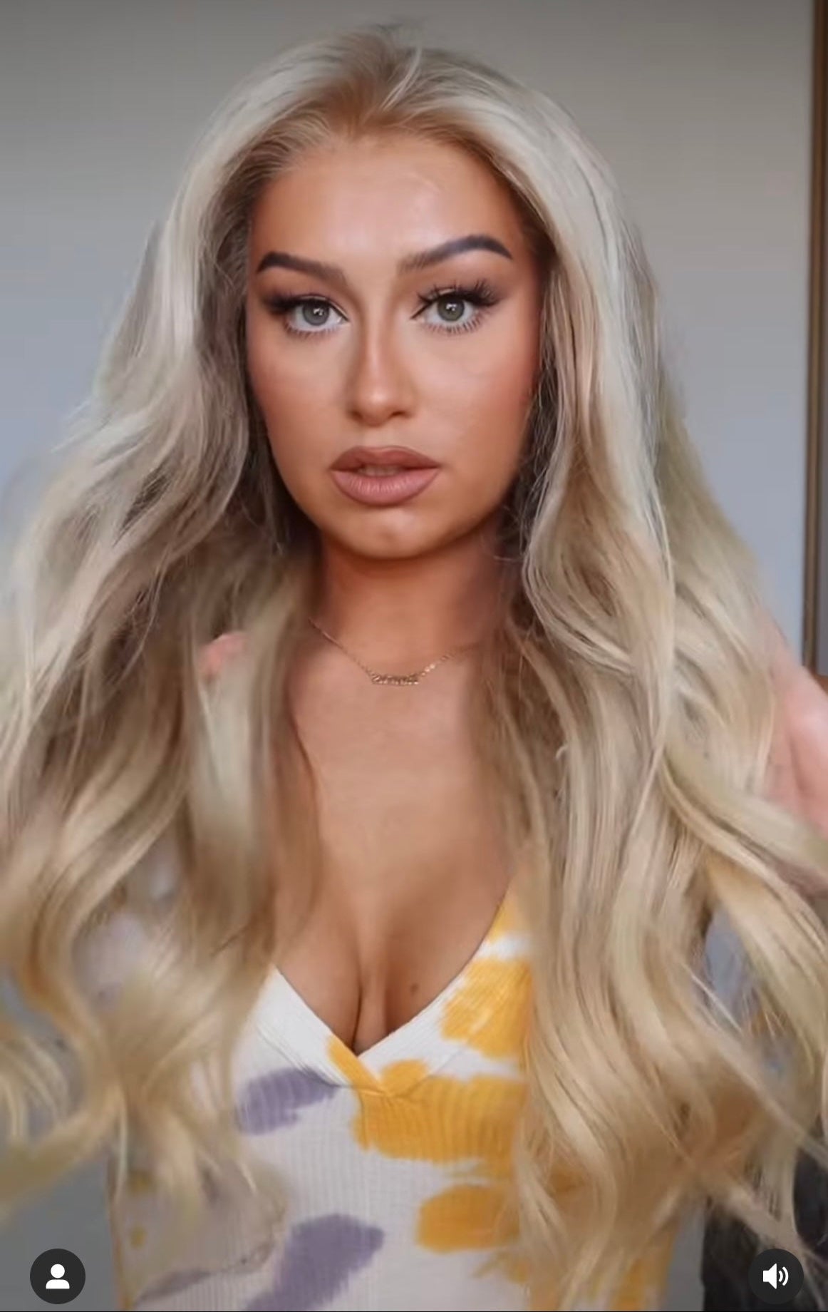 Model wearing blonde balayage 24-inch HD lace human hair wig in body wave texture – Nuola Wigs.