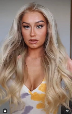 Model wearing blonde balayage 24-inch HD lace human hair wig in body wave texture – Nuola Wigs.