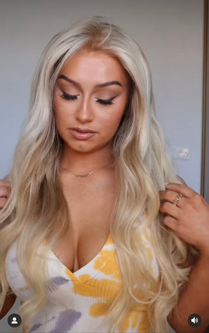 Model wearing blonde balayage 24-inch HD lace human hair wig in body wave texture – Nuola Wigs.