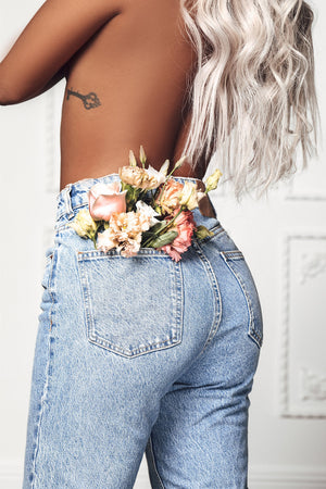 Model wearing blonde balayage 24-inch HD lace human hair wig in body wave texture – Nuola Wigs.