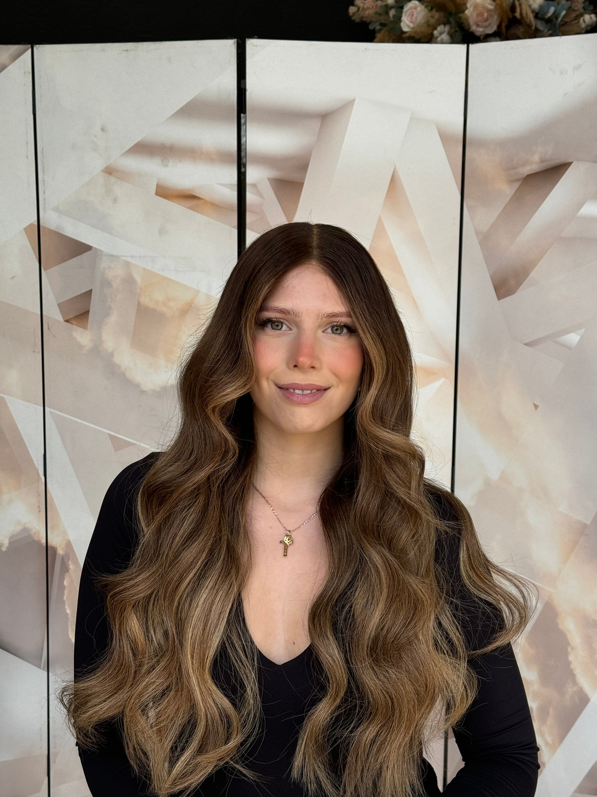 Model wearing blonde balayage 24-inch HD lace human hair wig in body wave texture – Nuola Wigs.