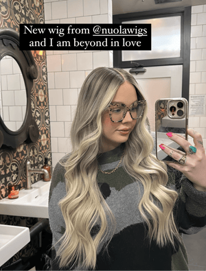 Model wearing blonde balayage 24-inch HD lace human hair wig in body wave texture – Nuola Wigs.