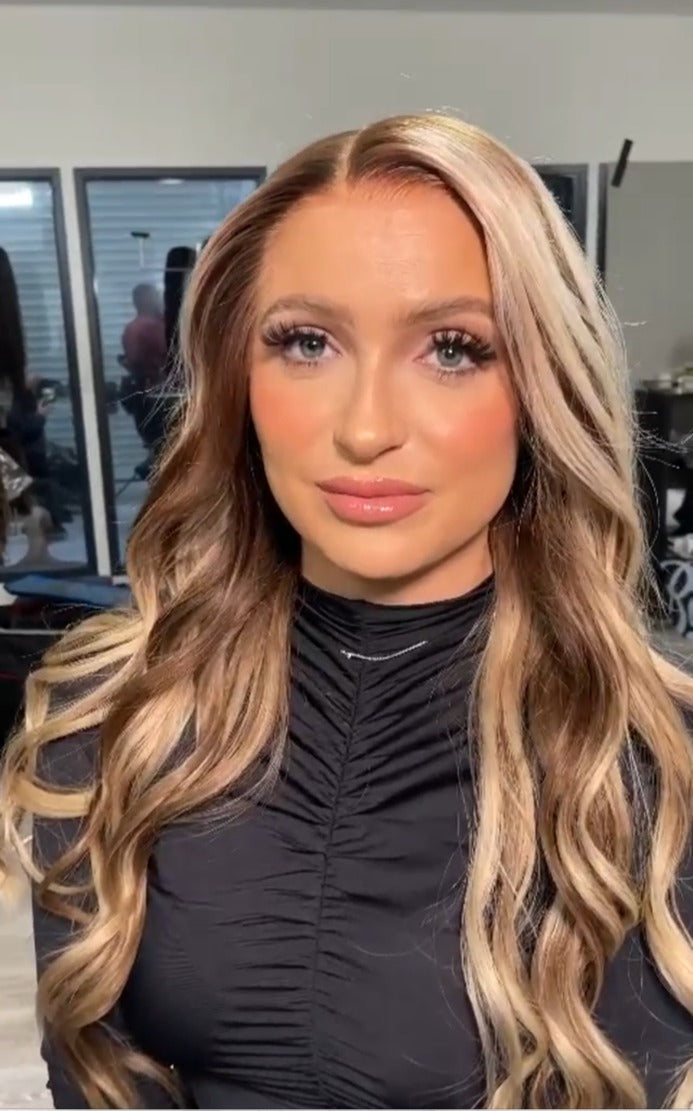 Model wearing blonde balayage 26-inch HD lace human hair wig in body wave texture – Nuola Wigs.