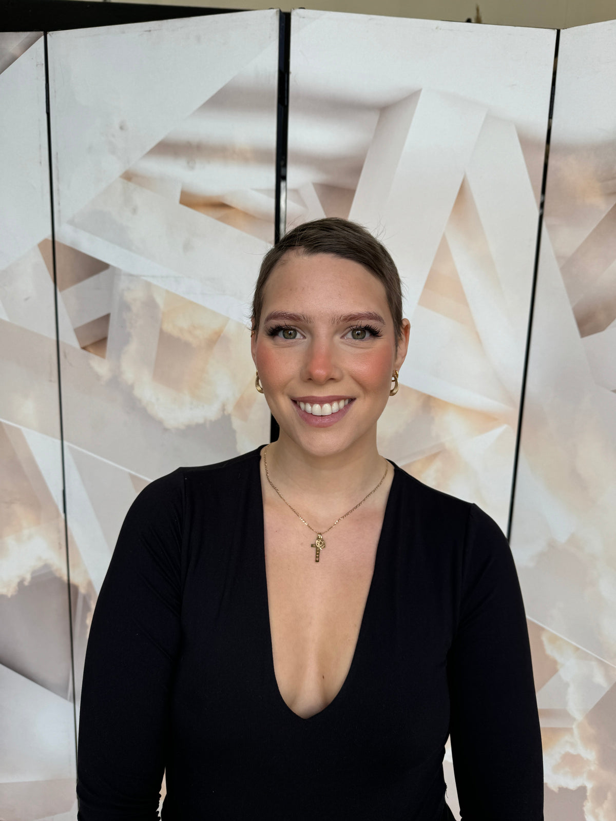 Model wearing blonde balayage 26-inch HD lace human hair wig in body wave texture – Nuola Wigs.