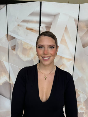 Model wearing blonde balayage 26-inch HD lace human hair wig in body wave texture – Nuola Wigs.