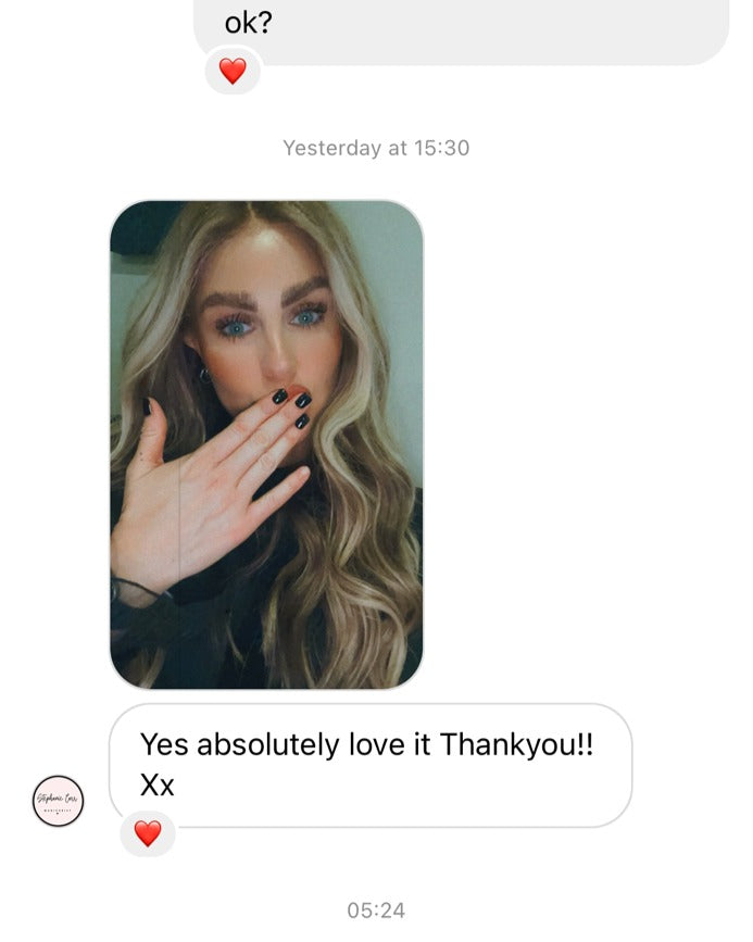 Model wearing blonde balayage 26-inch HD lace human hair wig in body wave texture – Nuola Wigs.