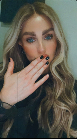 Model wearing blonde balayage 26-inch HD lace human hair wig in body wave texture – Nuola Wigs.