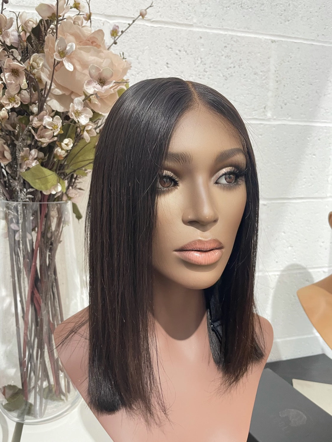 Model wearing brown balayage 14-inch HD lace human hair wig in body wave texture – Nuola Wigs.
