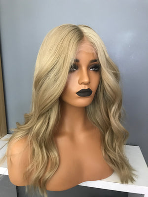 Model wearing brown balayage 18-inch HD lace human hair wig in body wave texture – Nuola Wigs.