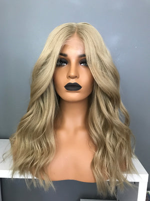 Model wearing brown balayage 18-inch HD lace human hair wig in body wave texture – Nuola Wigs.