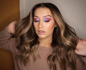 Model wearing brown balayage 20-inch HD lace human hair wig in body wave texture – Nuola Wigs.