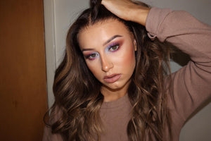 Model wearing brown balayage 20-inch HD lace human hair wig in body wave texture – Nuola Wigs.