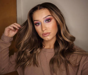 Model wearing brown balayage 20-inch HD lace human hair wig in body wave texture – Nuola Wigs.