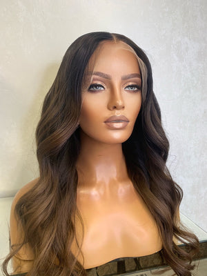 Model wearing brown balayage 20-inch HD lace human hair wig in body wave texture – Nuola Wigs.