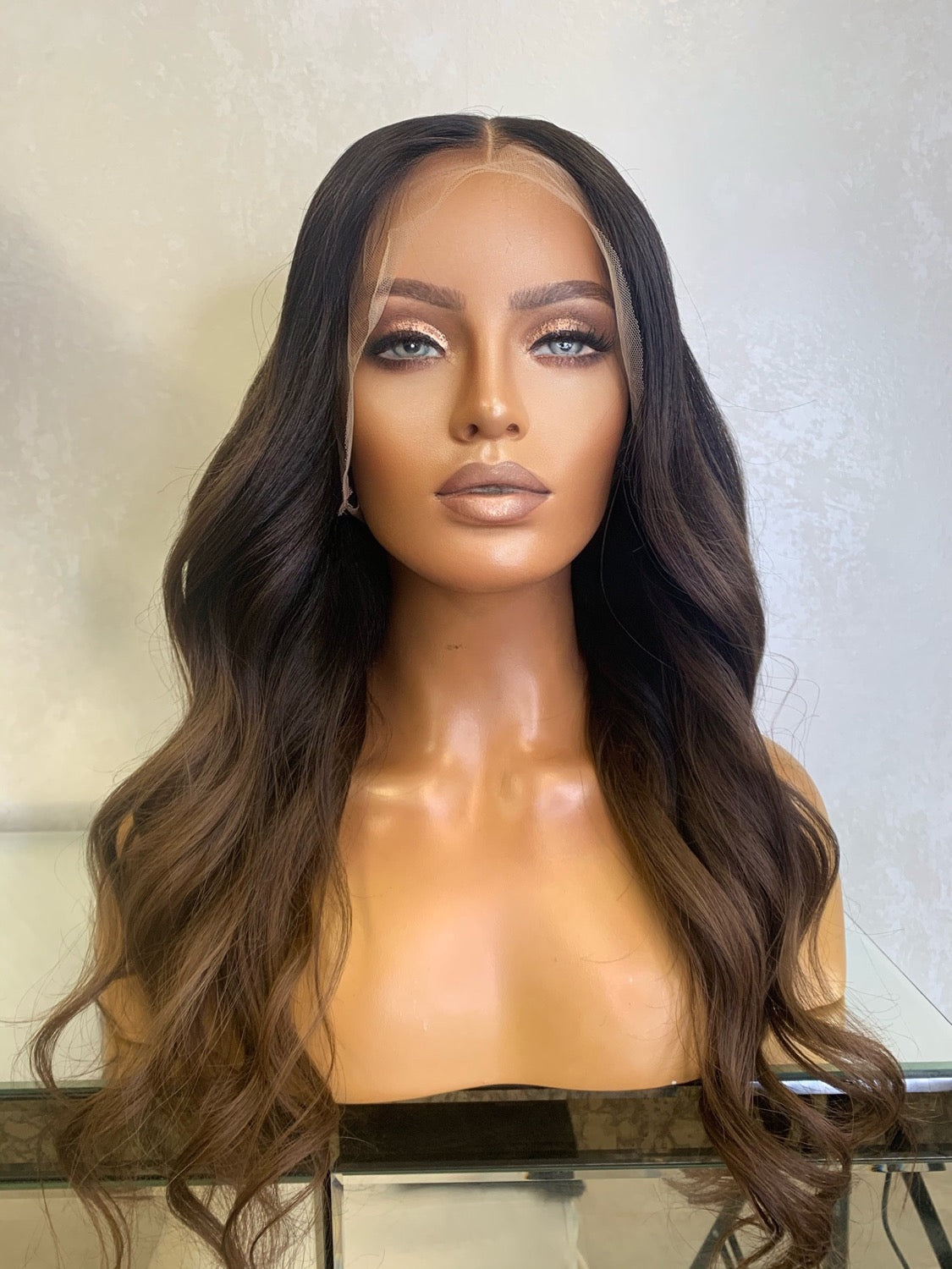 Model wearing brown balayage 20-inch HD lace human hair wig in body wave texture – Nuola Wigs.