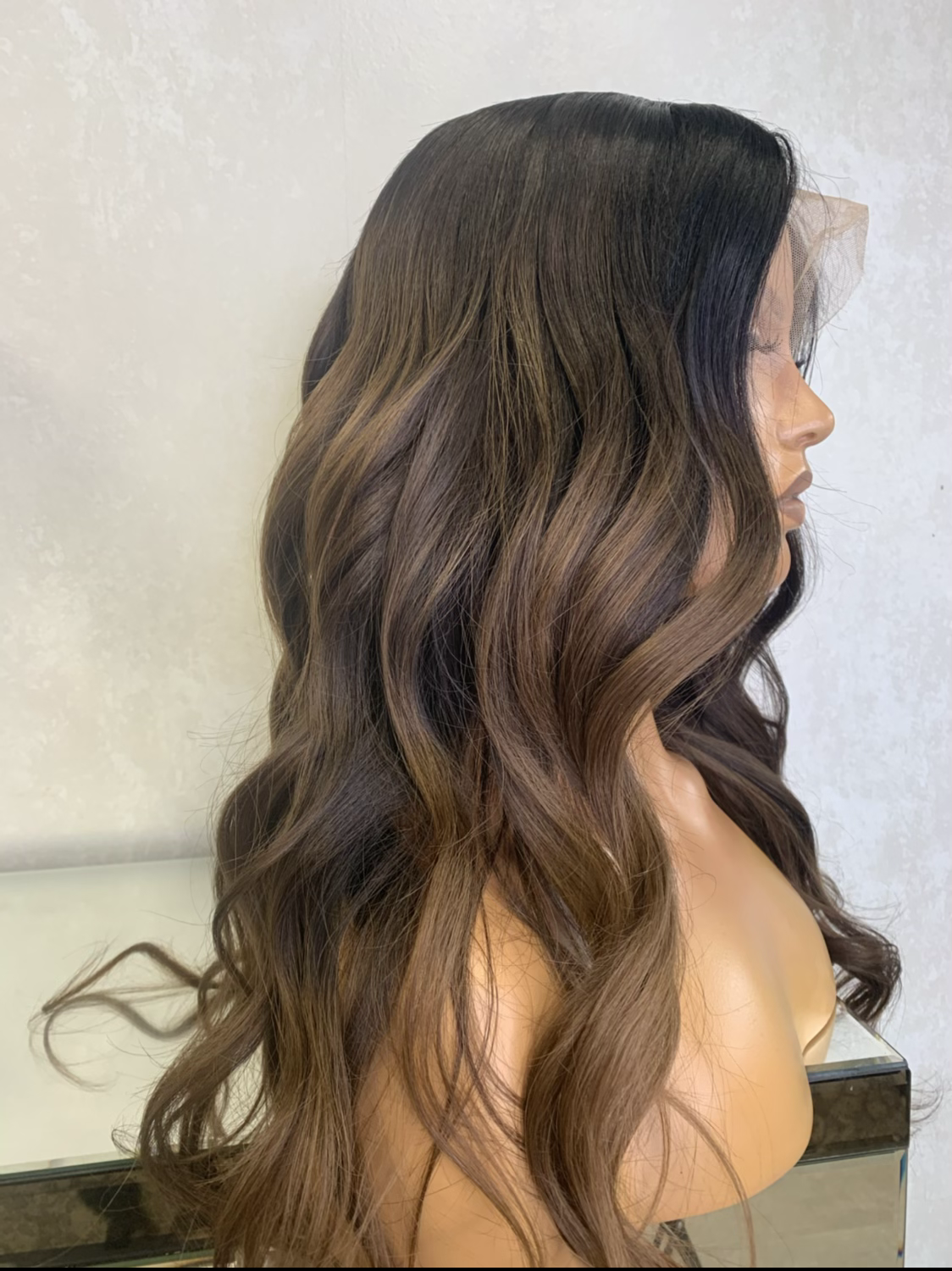 Model wearing brown balayage 20-inch HD lace human hair wig in body wave texture – Nuola Wigs.