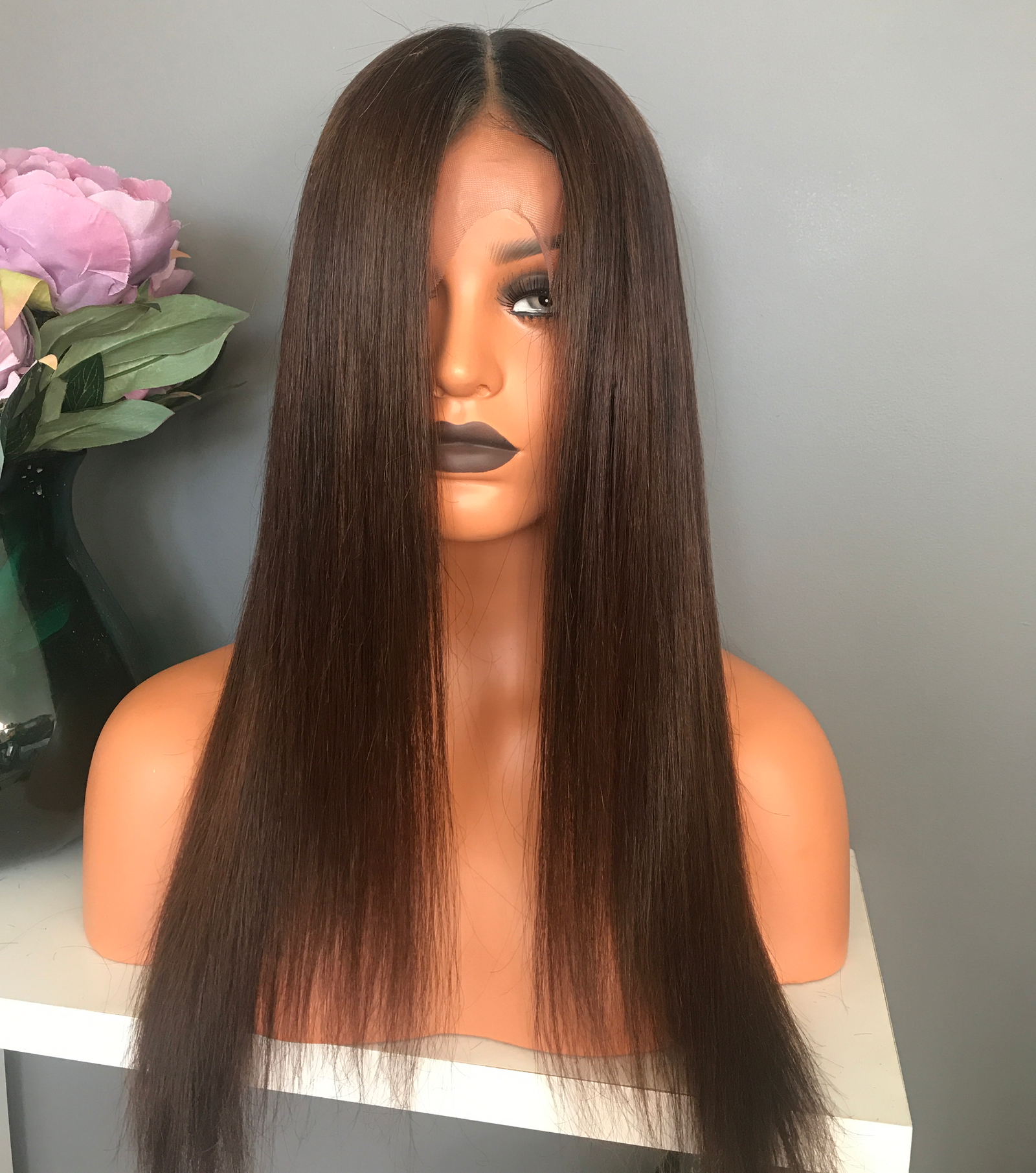 Model wearing brown balayage 20-inch HD lace human hair wig in body wave texture – Nuola Wigs.