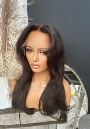 Model wearing brown balayage 20-inch HD lace human hair wig in body wave texture – Nuola Wigs.