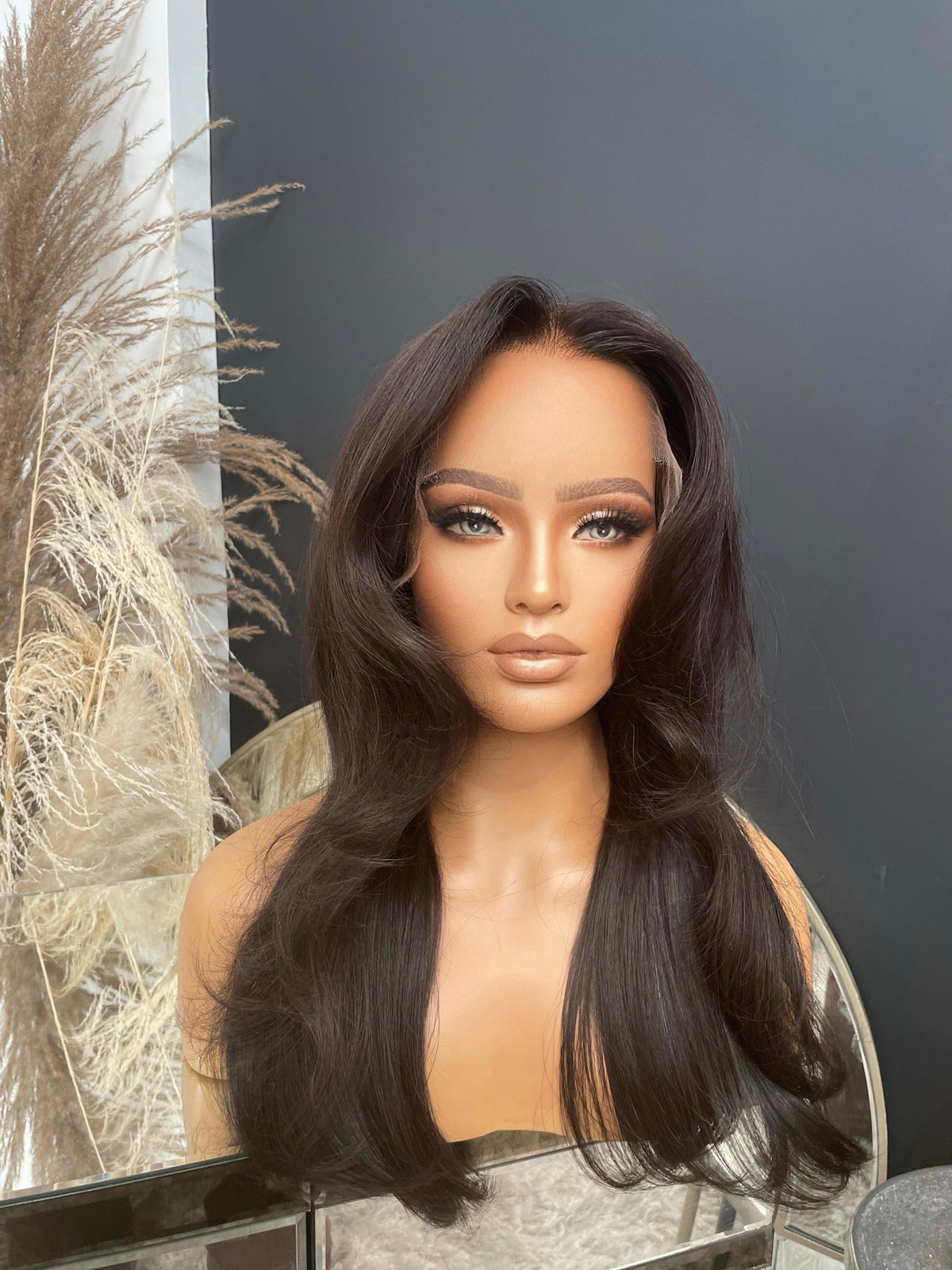 Model wearing brown balayage 20-inch HD lace human hair wig in body wave texture – Nuola Wigs.
