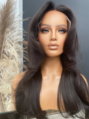Model wearing brown balayage 20-inch HD lace human hair wig in body wave texture – Nuola Wigs.
