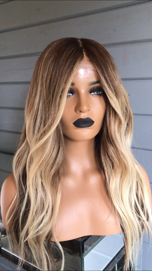 Model wearing brown balayage 20-inch HD lace human hair wig in body wave texture – Nuola Wigs.