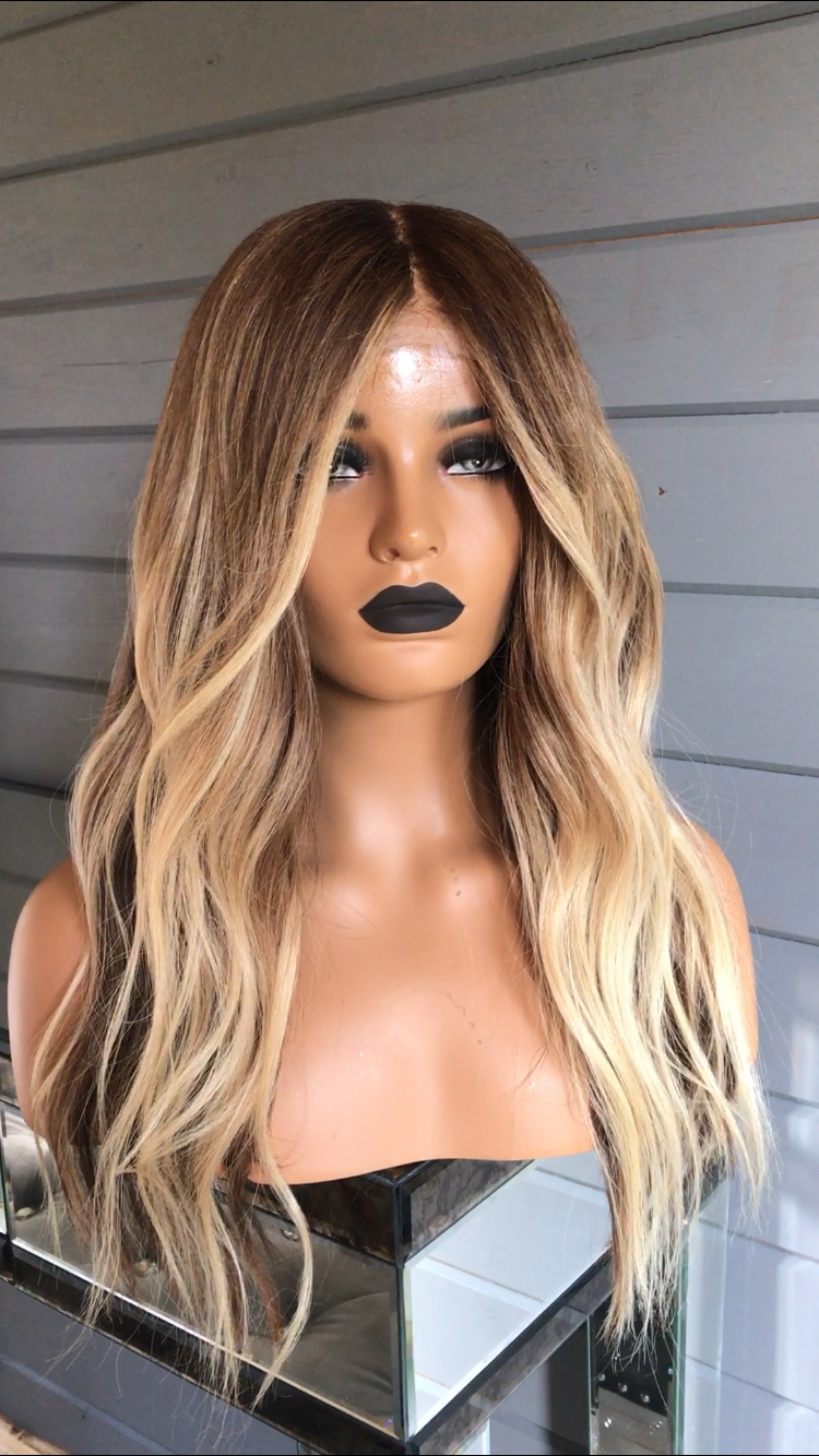 Model wearing brown balayage 20-inch HD lace human hair wig in body wave texture – Nuola Wigs.