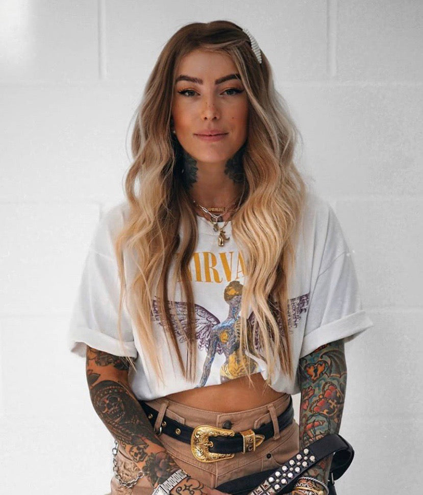 Model wearing brown balayage 20-inch HD lace human hair wig in body wave texture – Nuola Wigs.