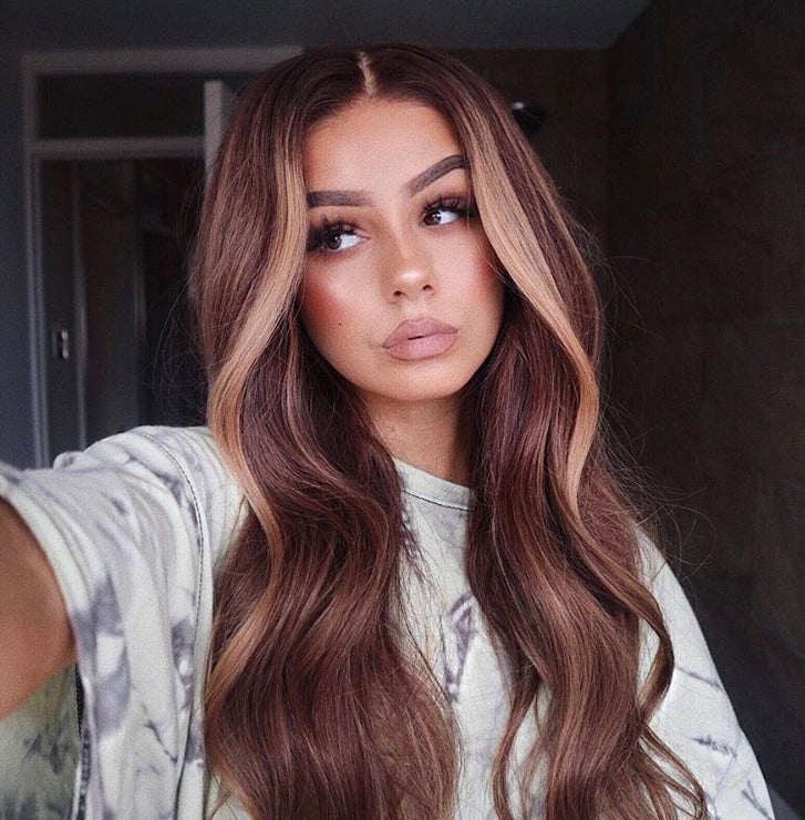 Model wearing brown balayage 22-inch HD lace human hair wig in body wave texture – Nuola Wigs.