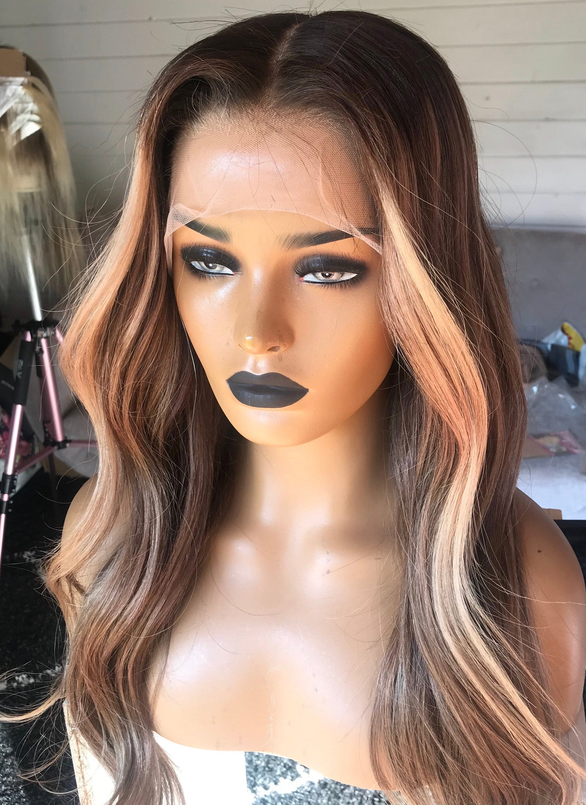 Model wearing brown balayage 22-inch HD lace human hair wig in body wave texture – Nuola Wigs.